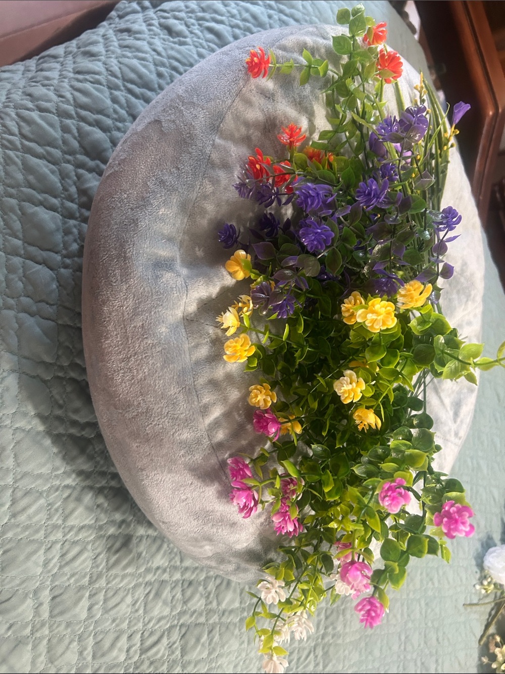 Plush Gray Decorative Round Pillow with Floral Accent